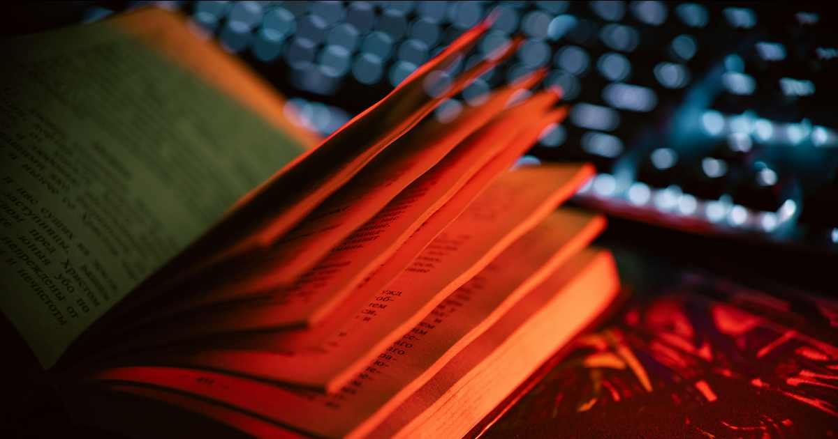 Book next to a computer keyboard representing an online book order