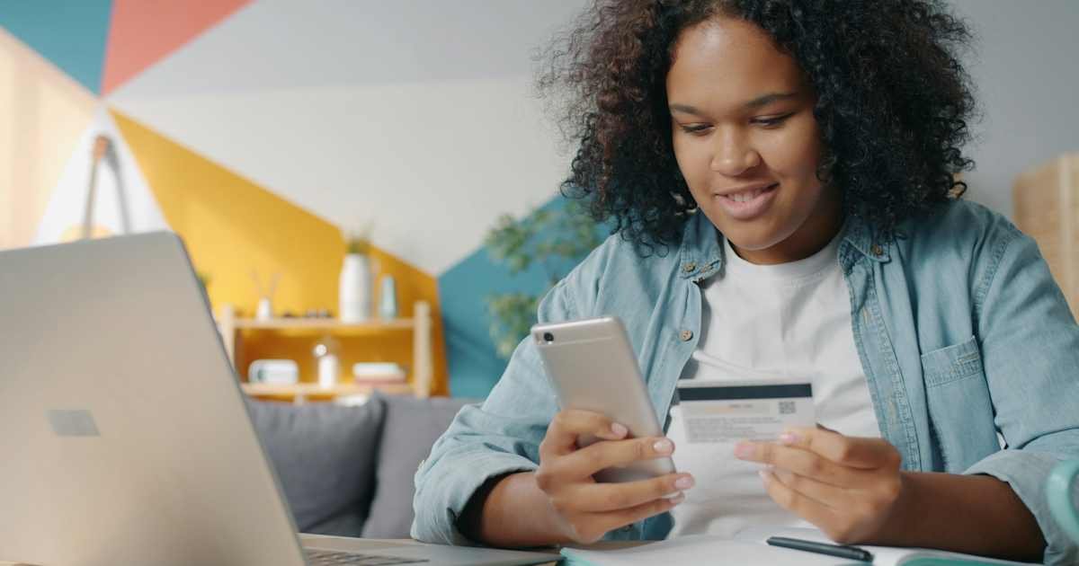 Person reviewing an online subscription payment using a smartphone