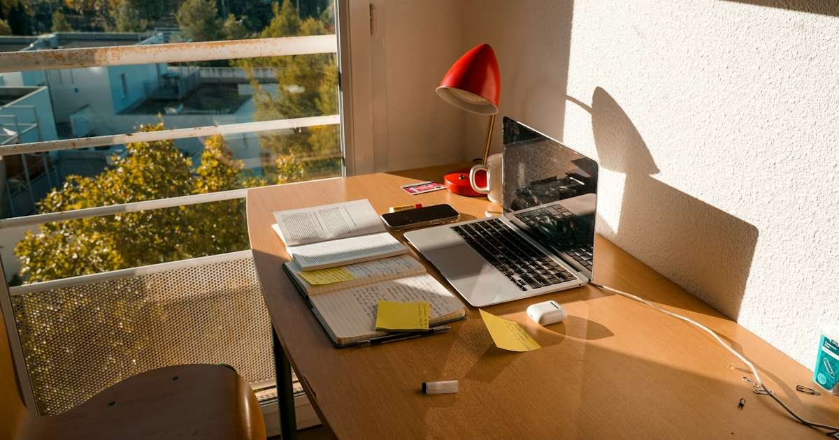 How Do I Dispute a Charge on My Chase Credit Card? 1 Desk with laptop and notebook while reviewing a credit card transaction