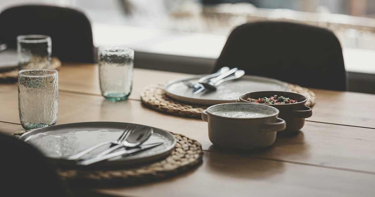 Table set for a restaurant meal illustrating a dining credit card charge