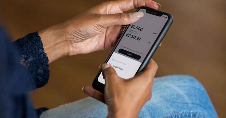 Hands reviewing a banking app to identify an unknown card charge