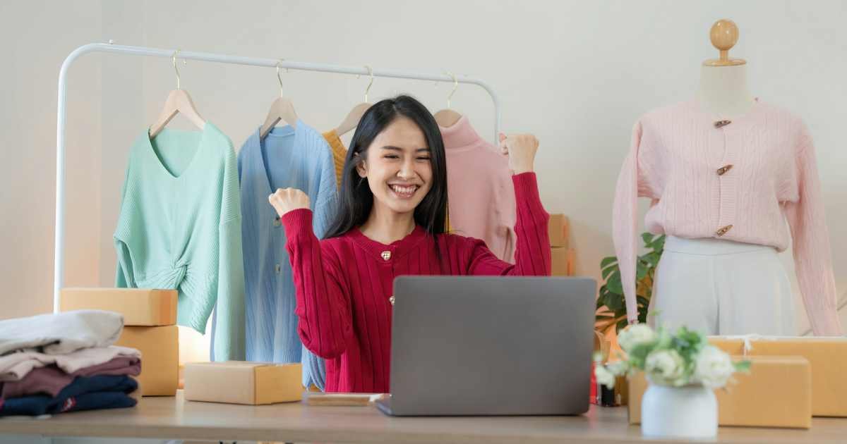 Woman at a laptop checking an online clothing order