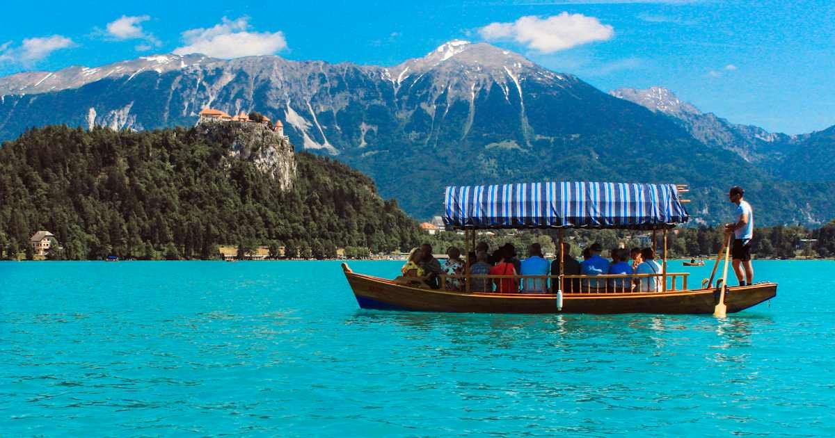 Sightseeing boat with passengers on a lake illustrating an activity reservation