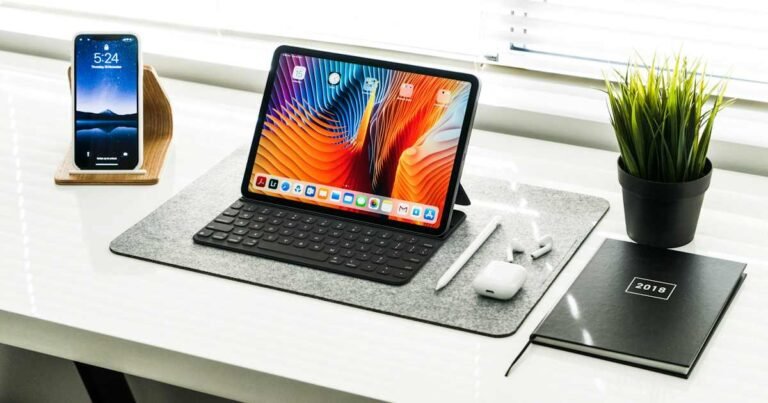Tablet and electronics on a desktop representing Apple billing records