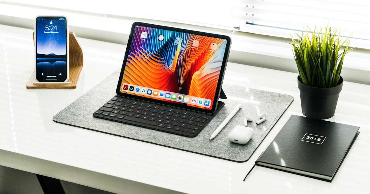 What Is Apple Infinite Loop Charge on Credit Card? 1 Tablet and electronics on a desktop representing Apple billing records